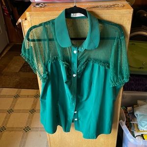 Emerald green button top, buttons shaped like hearts, with polka dot mesh